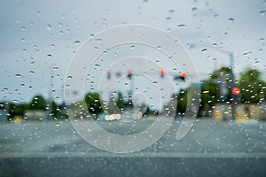 Raindrops on the windshield while driving on a rainy day, California