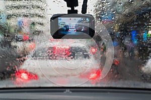 Raindrops on windshield car in traffic jam