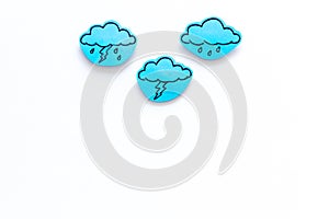 Rainfall forecast concept. Weather icons. Rainy cloud, lightening on white background top view copy space