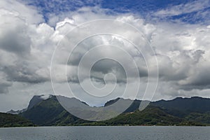 Rainforests on the mountains in the rain misty clouds on the island Moorea