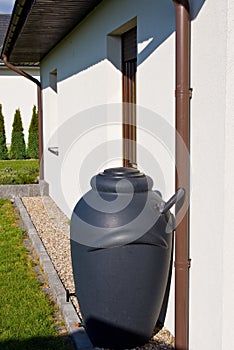 Rainwater barrel downspout modern design house exterior