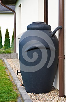 Rainwater barrel downspout modern design house exterior