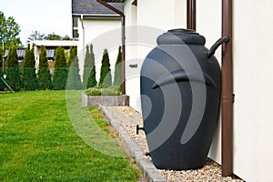 Rainwater barrel downspout modern design house exterior