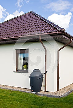 Rainwater barrel downspout modern design house exterior