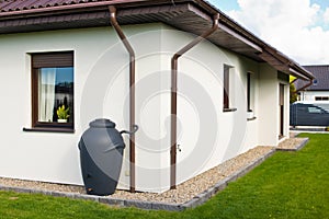 Rainwater barrel downspout modern design house exterior photo