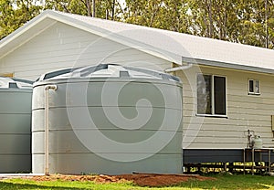 Rainwater conservation tanks on new house photo