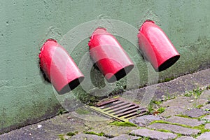 Rainwater downpipe with metal frame.