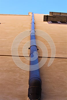 Rainwater drain pipe of a period building in the historic center of Palermo in Italy