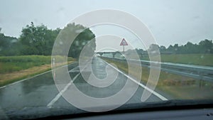 Rainy car ride on a straight road