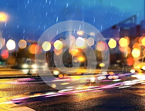 Rainy city blurred light at night  modern building and wet asphalt colorful light reflection night cars  traffic urban lifestyle b