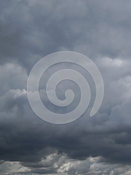 Tones of grey from dark to light within rainy cloudscape