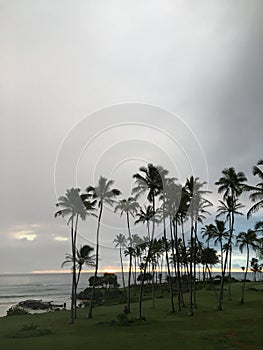 Rainy and Cloudy Sunrise in October in Wailua Bay near Hikinaakala Heiau on Kauai Island, Hawaii.