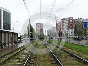 Rainy cloudy weather. Tram rails