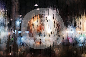 Rainy Day in City Concept. Raindrops on Glass Window