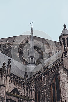 Rainy Day Detail: Cathedral Spire in Dinant Against Hillside Backdrop