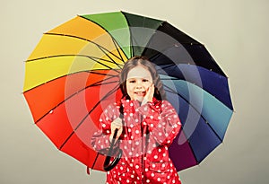 Rainy day fun. Happy walk under umbrella. There is rainbow always after the rain. Enjoy rain concept. Fall season. Kid