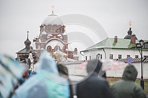 rainy day people going to church