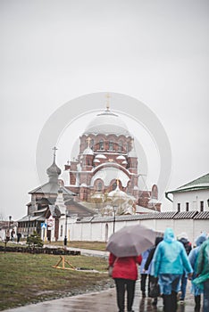 rainy day people going to church