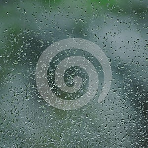 Rainy day, raindrops on wet window glass, vertical bright abstract rain water background pattern detail, macro closeup, detailed