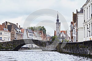 Rainy day reflections in Bruges. Old town view from water