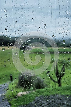 Rainy day. Window view. Raindrops. Waterdrop on the glasses.