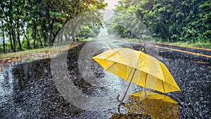 On a rainy day, a yellow umbrella was lying in the middle of a deserted road. An ominous image. Generative AI.