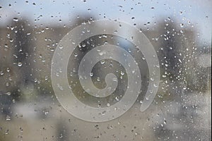 Rainy days, drops on window, storming weather, rain background, drops and bokeh