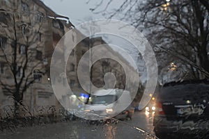 Rainy days, Evening,rain drops on the window with traffic blur