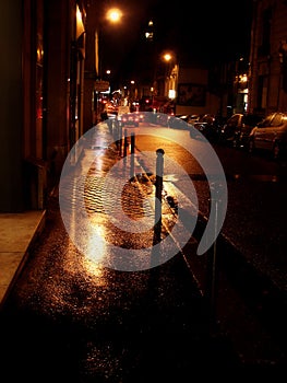 Rainy golden street in Paris