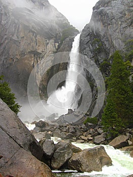 Yosemite National Park, Sierra Nevada, Thundering Lower Yosemite Falls on Rainy Spring Day, California, USA photo