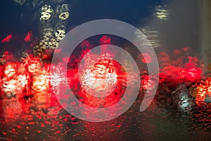 Rainy Night Traffic Lights Bokeh on Windshield