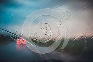 Rainy road through car window