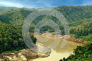 During the rainy season, the dense green hills blend into the blue sky. Sangu river flows below. Hilly region of Bandarban