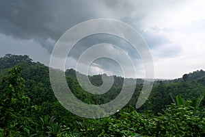 During the rainy season, thick green hills are mixed with thick black clouds in the sky. Hilly region of Bandarban district of