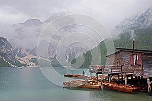 Rainy weather at Lago di Braies. Summer cloudy day.