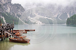 Rainy weather at Lago di Braies. Summer cloudy day.