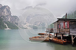 Rainy weather at Lago di Braies. Summer cloudy day.