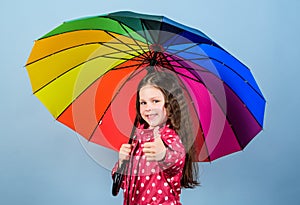 Rainy weather with proper garments. Rainy day fun. Happy walk under umbrella. Enjoy rain concept. Fall season. Kid girl