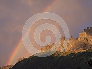 Rainy weather with rainbow over the French Alps