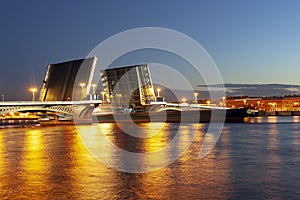 The raised Blagoveshchensky bridge at white nights