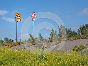 Raised coastal road along the ribble estuary near southport merseyside with turning and speed limit traffic signs