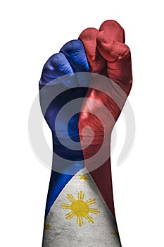 Raised fist painted in Philippine Flag. Showing strong and love for the country. photo