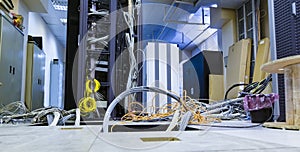 Raised floor and suction tool in modern interior of server room in datacenter