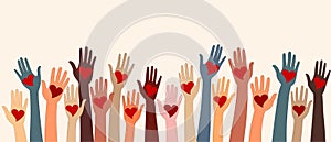 Raised hands of volunteer people holding a heart. People diversity. Charitable donation. NGO. Aid