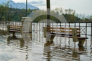 Raised water level from the river arrives on the sidewalk