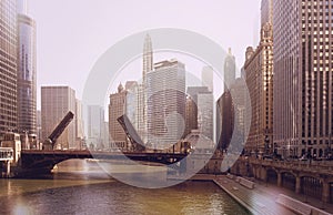 The raising of the bridge on the Chicago River and sailboats move from their harbor on Lake Michigan. vintage photo