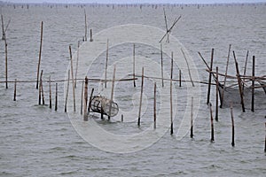 Raising fish in floating islands around Koh Yo Songkhla Lake Fisherman`s House at sunset at Songkhla Lake, Yo Island