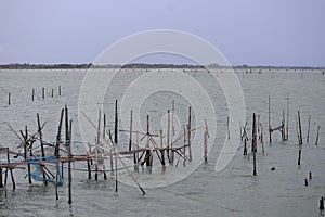 Raising fish in floating islands around Koh Yo Songkhla Lake Fisherman`s House at sunset at Songkhla Lake, Yo Island