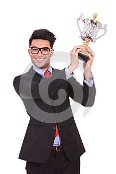 Raising his trophy & smiling