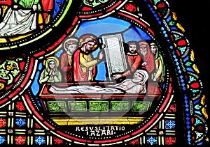 Raising of Lazarus, stained glass window from Saint Germain-l`Auxerrois church in Paris, France